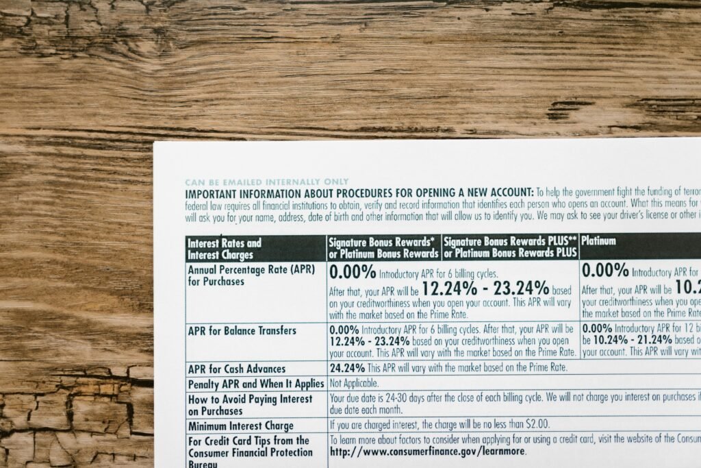 pexels-photo-7821470-7821470 A detailed financial document listing interest rates on a textured wooden table.